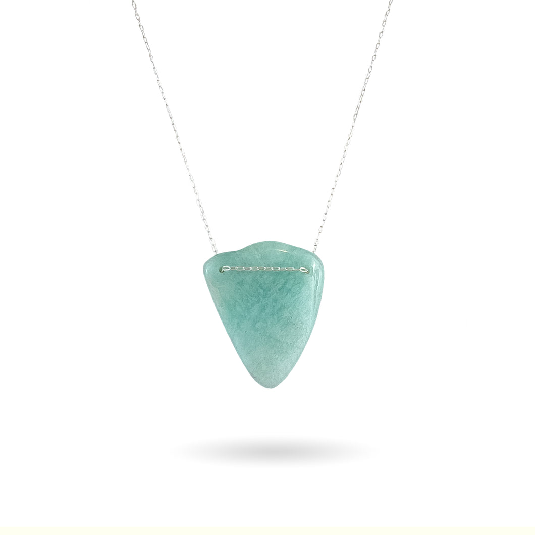 This natural Amazonite gemstone has been polished but kept in its natural 