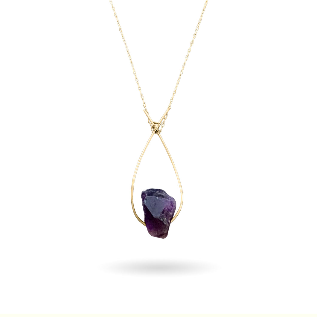 A deep violet-colored natural rough Amethyst gemstone set on a 14K gold-fill pendant and strung along a dainty paper clip cable chain, then finished with a vintage-inspired pearl box clasp. Amethyst is the birthstone for those born in the month of February (Aquarius/Pisces) and the stone for commemorating 6th wedding anniversaries! 