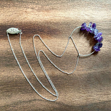 Load image into Gallery viewer, This beautiful cluster of natural rough Amethyst stones are set on a sterling silver half-circle, hung from a dainty sterling silver satellite curb chain, and finished with a vintage-inspired pearl box clasp.
