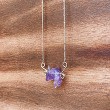 Load image into Gallery viewer, Natural rough Amethyst gemstones are suspended between two abstract sterling silver butterfly wings, attached to a dainty sterling silver satellite curb chain, and finished with a vintage-inspired pearl box clasp. 
