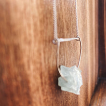 Load image into Gallery viewer, This beautiful cluster of natural rough Aquamarine stones are set on a sterling silver half-circle, hung from a dainty sterling silver curb chain, and finished with a vintage-inspired pearl box clasp.
