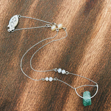 Load image into Gallery viewer, This beautiful natural mined rough Aquamarine stone is set on a sterling silver half-circle, hung from a dainty sterling silver rectangular paperclip cable chain, adorned with Freshwater Pearls (six in total), and finished with a vintage-inspired pearl box clasp.
