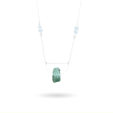 Load image into Gallery viewer, This beautiful natural mined rough Aquamarine stone is set on a sterling silver half-circle, hung from a dainty sterling silver rectangular paperclip cable chain, adorned with Freshwater Pearls (six in total), and finished with a vintage-inspired pearl box clasp.
