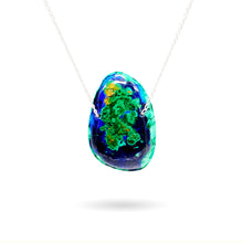 Cargar imagen en el visor de la galería, This stunning natural 85-carat Azurite Malachite Chrysocolla Pendant from Peru is strung on a sterling silver satellite curb chain and is perfect for any time of day or night as a statement piece or for layering with other necklaces. With such a large, bright stone as this, the vivid blues, greens, and copper colors will certainly grab anyone&#39;s attention. This piece is truly one of a kind.
