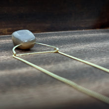 Load image into Gallery viewer, This stunning natural Black Moonstone gemstone has colors of slate grey and tan with a velvety silver flash across the surface when it is moved about in the light. This Black Moonstone is set on a hammered 14K gold-fill half-circle, hung from a dainty 14K gold-fill curb chain, and finished with a vintage-inspired pearl box clasp. The perfect necklace for those looking for a minimal design, but still want a unique gemstone rarely seen in most jewelry collections.
