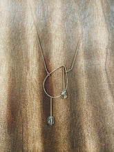 Load image into Gallery viewer, Earthy, artful and sophisticated, these pear-shaped Rutilated Quartz dangle separately from an asymmetrical 14K gold-filled teardrop pendant, attached to a dainty curb chain and a pearl box clasp
