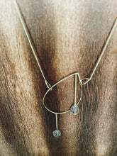 Load image into Gallery viewer, Earthy, artful and sophisticated, these pear-shaped Rutilated Quartz dangle separately from an asymmetrical 14K gold-filled teardrop pendant, attached to a dainty curb chain and a pearl box clasp
