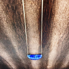 Load image into Gallery viewer, Lapis Lazuli is known as the stone of friendship and a crystal of truth. This natural lapis lazuli gemstone is deep blue in color with striking reflective gold flakes throughout. It is strung onto a dainty 14K GF chain and finished with a vintage-inspired pearl box clasp. 
