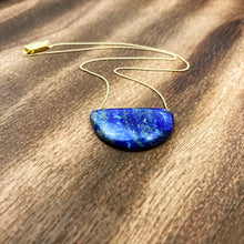 Cargar imagen en el visor de la galería, Lapis Lazuli is known as the stone of friendship and a crystal of truth. This natural lapis lazuli gemstone is deep blue in color with striking reflective gold flakes throughout. It is strung onto a dainty 14K GF chain and finished with a vintage-inspired pearl box clasp. 
