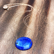 Load image into Gallery viewer, Lapis Lazuli is known as the stone of friendship and a crystal of truth. This natural Lapis Lazuli gemstone is polished into an oval cabochon and strung on a dainty 14K gold-fill rose gold cable chain, which has been doubled up on both sides, and completed with a vintage-inspired pearl box clasp.
