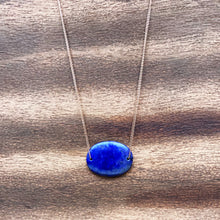 Load image into Gallery viewer, Lapis Lazuli is known as the stone of friendship and a crystal of truth. This natural Lapis Lazuli gemstone is polished into an oval cabochon and strung on a dainty 14K gold-fill rose gold cable chain, which has been doubled up on both sides, and completed with a vintage-inspired pearl box clasp.
