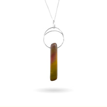 Load image into Gallery viewer, This natural Mookaite gemstone has been polished into a long rectangular shape and hung from a hammered sterling silver circle/half moon pendant and strung on a sterling silver curb chain. This stone is uniquely attractive with plenty of color including pink, green, yellow, mauve, red, and gray.
