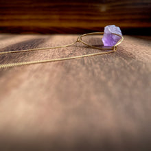 Load image into Gallery viewer, A pastel purple crystal point of Fluorite hangs from a hammered 14K gold-fill half-circle pendant and is strung along a dainty 14K gold-fill curb chain, then finished with a vintage-inspired pearl box clasp. 
