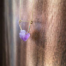 Cargar imagen en el visor de la galería, A pastel purple crystal point of Fluorite hangs from a hammered 14K gold-fill half-circle pendant and is strung along a dainty 14K gold-fill curb chain, then finished with a vintage-inspired pearl box clasp. 
